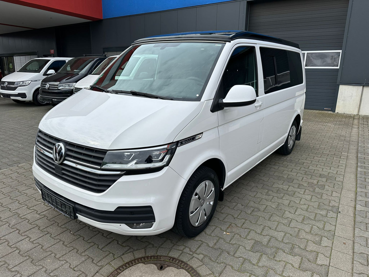 Volkswagen T6.1 Camper 2.0 TDI 150PS unfallfrei | Wohnmobil mit Hubdach Schlafdach, PDC, Navi, Rückfahrkamera | Campervan Umbau 5 Sitzer