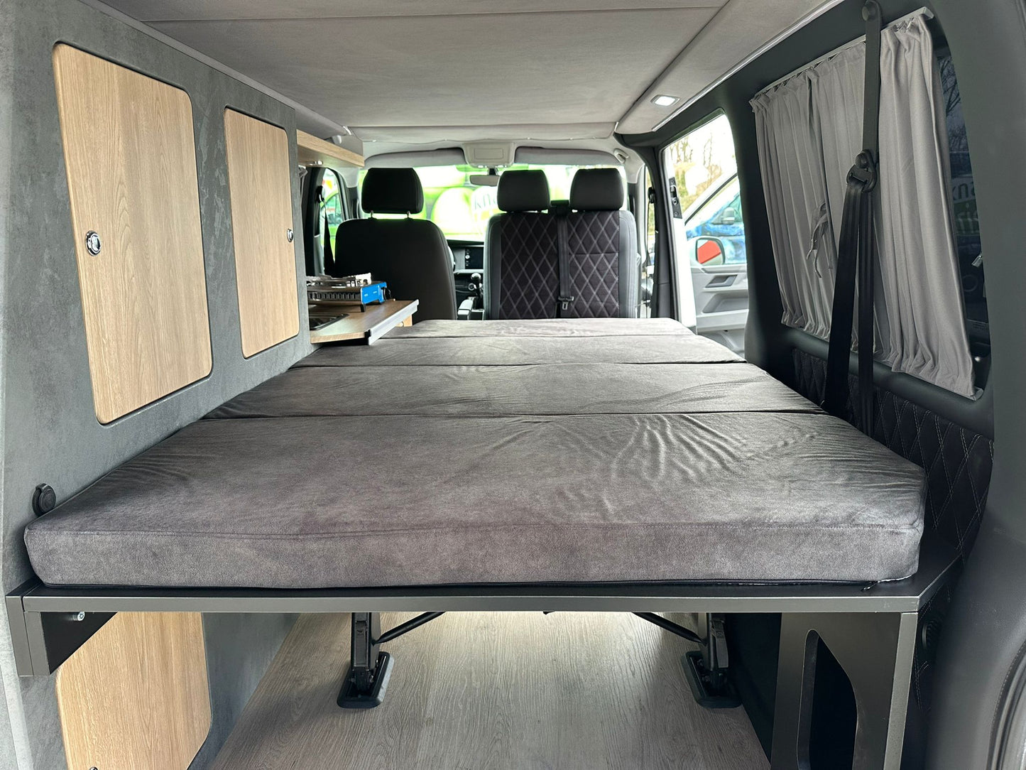 Volkswagen T6.1 Camper 2.0 TDI 150PS unfallfrei | Wohnmobil mit Hubdach Schlafdach, PDC, Navi, Rückfahrkamera | Campervan Umbau 5 Sitzer
