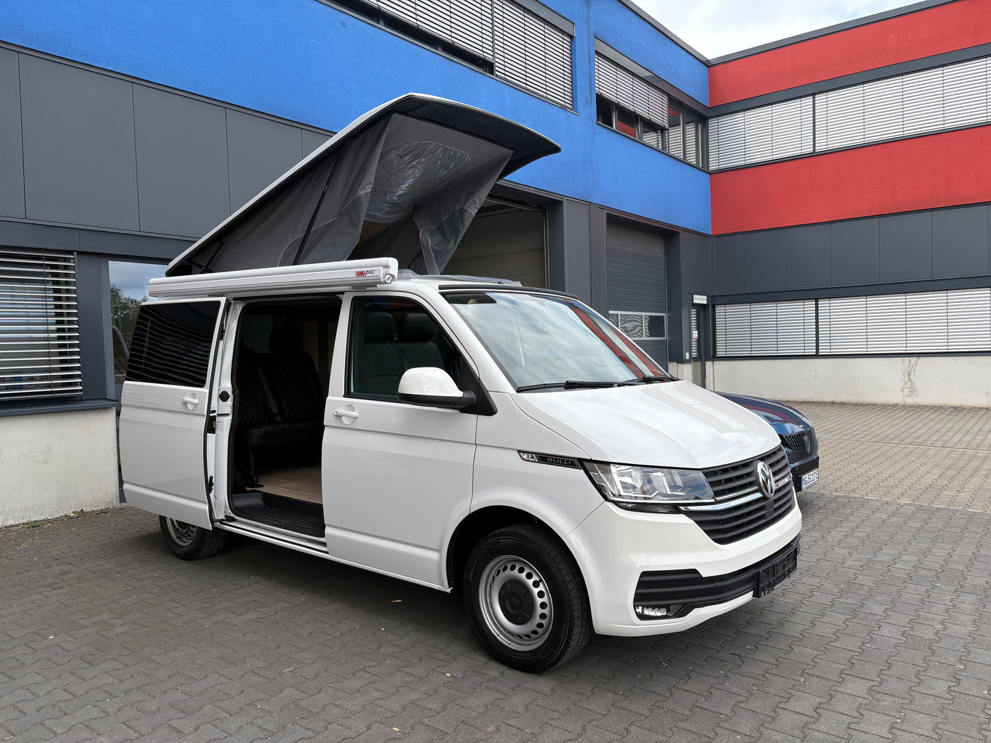 Volkswagen T6.1 Camper 2.0 TDI 150PS unfallfrei| mit Markise | Wohnmobil mit Hubdach Schlafdach, PDC, Navi, Rückfahrkamera | Campervan Umbau 5 Sitzer