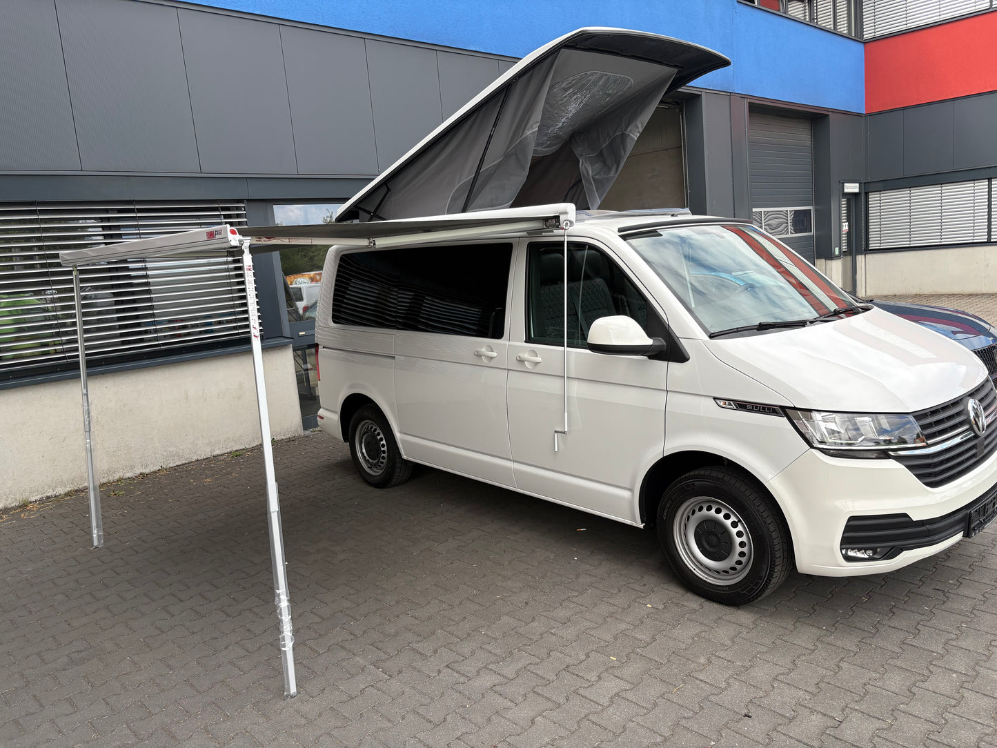 Volkswagen T6.1 Camper 2.0 TDI 150PS unfallfrei| mit Markise | Wohnmobil mit Hubdach Schlafdach, PDC, Navi, Rückfahrkamera | Campervan Umbau 5 Sitzer